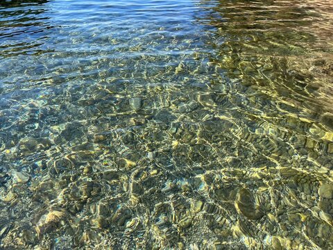 Clear water pebbles stones at the seabed.