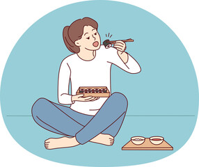 Woman sit on floor eating sushi