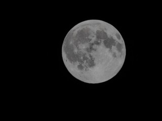 Closeup of the moon shining in a dark night sky