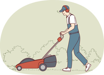 Man in uniform with lawn mower