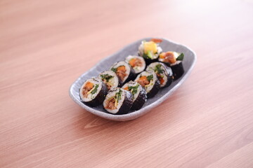 Sushi roll japanese food style on wooden table background.