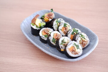 Sushi roll japanese food style on wooden table background.