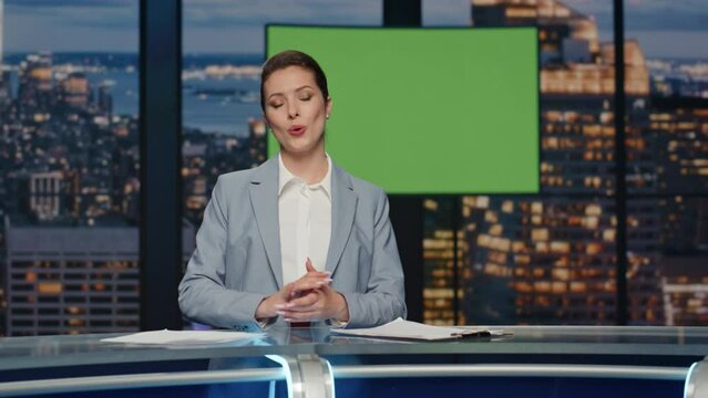 Female news presenter reporting in broadcasting studio. Positive woman talking