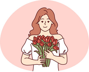 Portrait of woman with flowers in hands