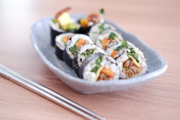 Sushi roll japanese food style on wooden table background.