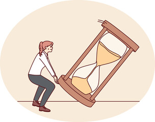 Fototapeta premium Businesswoman try to flip sand clock