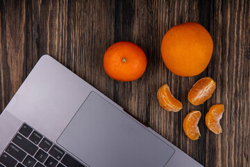 Top view fresh sliced orange on dark background ripe mellow fruit juice color citrus tree citrus, Whole and sliced ripe oranges placed on marble background, half orange fruit.