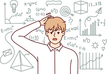Embarrassed guy student studying mathematics, scratching back head standing near school chalkboard