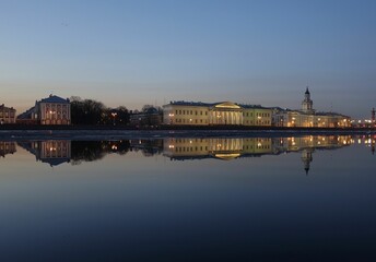 Reflection of famous buildings in Saint Petersburg on the River Neva in the evening