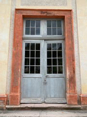 Fototapeta na wymiar The entrance door of a neighboring building on the territory of the Favorite Palace in the Baroque style in the German city of Rastatt