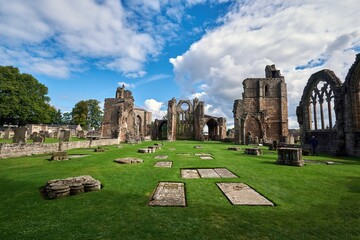 Fototapeta premium Elgin Cathedral with a cloudy blue sky in the background, Elgin, Scotland