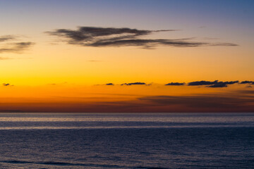 Fototapeta na wymiar cloudy sunset on the sea