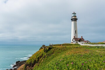 Fototapeta na wymiar Beautiful shot of a lighthouse on the California coast in summer