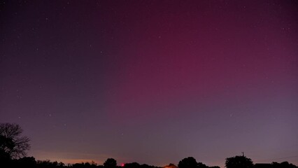 Long exposure time lapse of a Stable Auroral Red arc, or SAR arc, a rare space phenomenon over north east Oklahoma sky on November 5th, 2023.  - Powered by Adobe