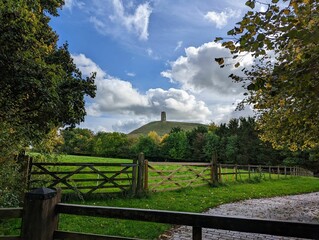 Glastonbury Tor hill topped by the roofless St Michael's Tower in Somerset, England.
