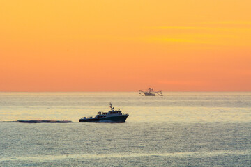 fishing boats at sunrise