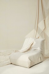 Vertical shot of a small white sofa sea in a white room with white cloth