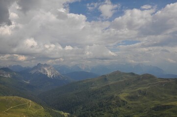 Obraz premium Beautiful landscape of big mountains of the Alps in Italy under the cloudy sky during the daytime