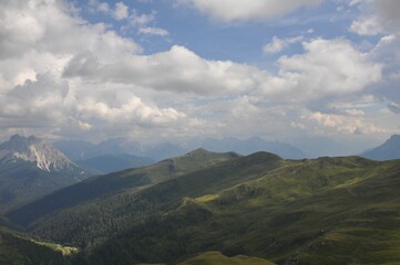 Obraz premium Beautiful landscape of big mountains of the Alps in Italy under the cloudy sky during the daytime