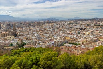Aerial view of the city of Malaga located in Spain, with beautiful mountains in the background