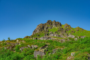 Lofoten Summer Landscape .Lofoten is an archipelago in the county of Nordland, Norway. Is known for a distinctive scenery with dramatic mountains and peaks, sea and ocean.