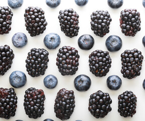 Blackberries and blueberrys on white background.