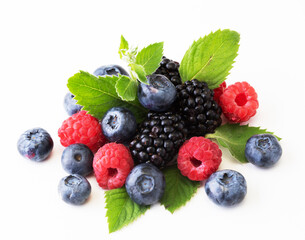 Mix berries with leaf of mint over white background