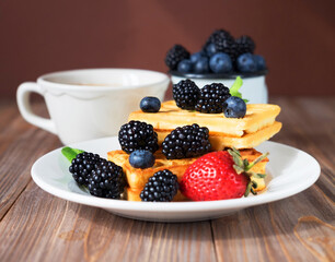 Waffles with blackberries and raspberries for breakfast