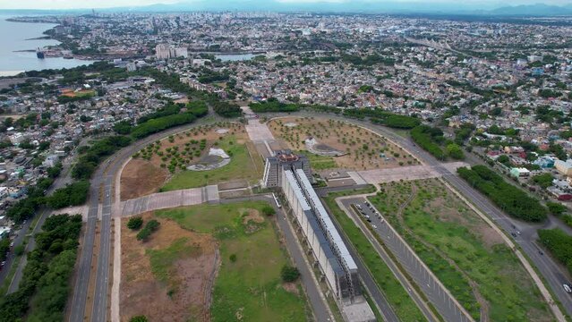Aerial cinematic footage of the beautiful Columbus Lighthouse monument and the flag of Dominican Republic in Santo Domingo