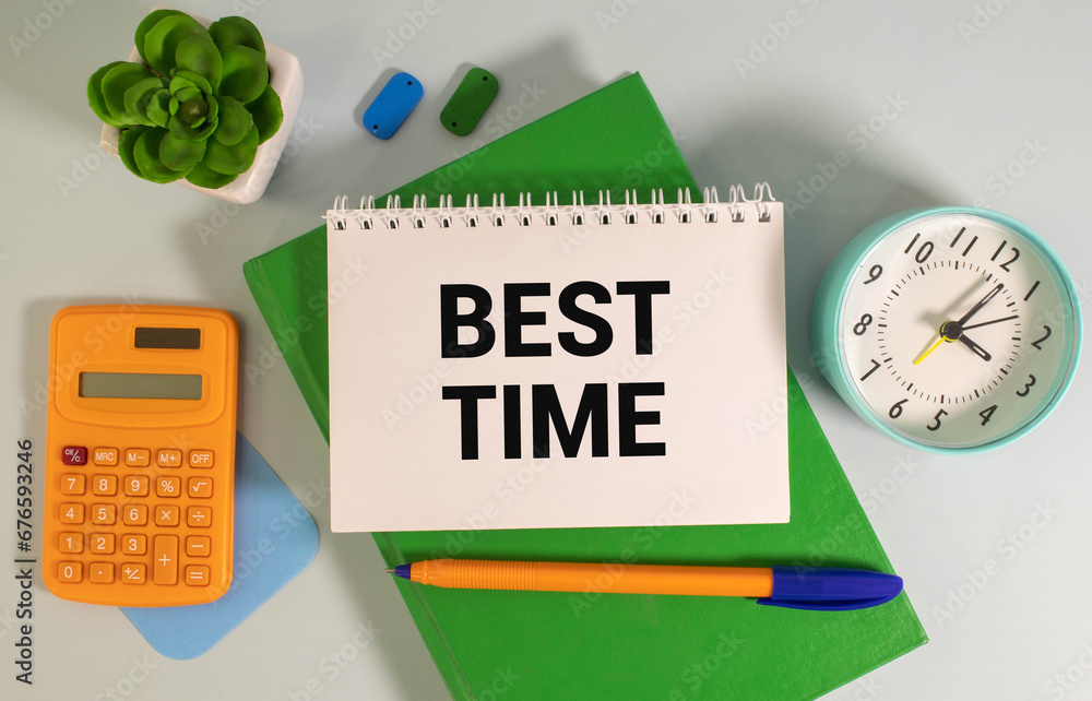 Poster best time text written on card with notebook and clipboard, grey background.