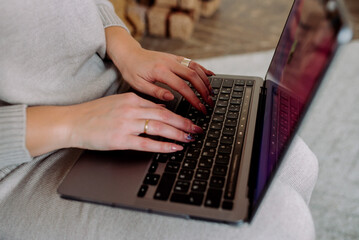 Woman freelancer working remotely on laptop