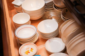 hand-washing dishes, symbolizing equality and shared responsibilities of men and women gender roles responsibilities. Hand washing vs dishwasher technological advances 