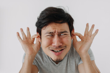 Asian man make funny teasing face for humor isolated on white.