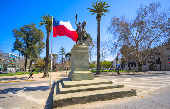Chilean flag near horse statue on Alameda àrl in small south american city