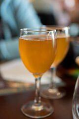 Aperitief for lunch and dinner in Limouge, France, alcoholic drink kir limousin made with champagne bubbles white wine and chestnut liqueur