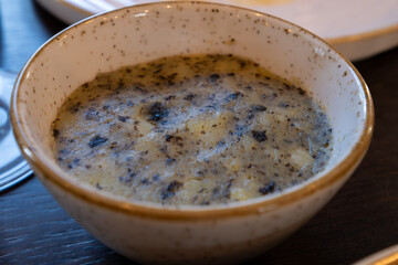 Side dish in restaurant in France, farm mashed potatoes cooked with green dried nori seaweed