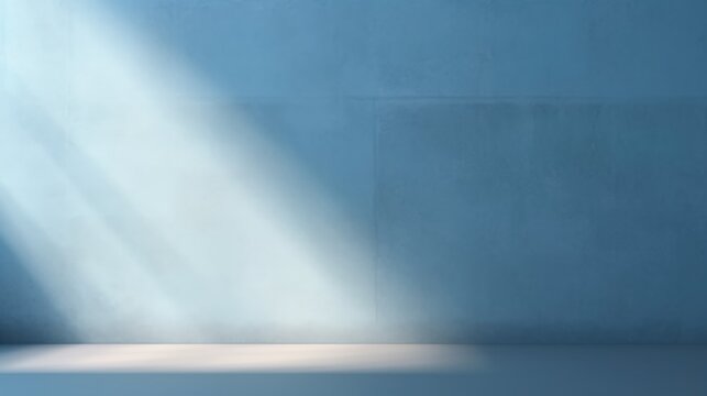 Abstract light blue background, perfect for product presentations. Shadows and light from the window on the cement wall Morning light enters through the diagonal window.