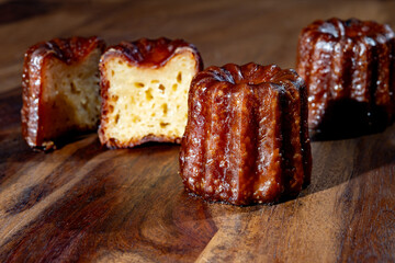 Canele, French pastry flavored with rum and vanilla, soft and tender custard center and  dark, caramelized crust specialty of Bordeaux region, France