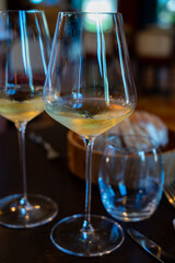 Tasting of Bordeaux white wine in Sauternes, left bank of Gironde Estuary, France. Glasses of white sweet French wine.