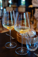 Tasting of Bordeaux white wine in Sauternes, left bank of Gironde Estuary, France. Glasses of white sweet French wine.