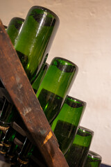 Wooden pupitre with bottles. Production of cremant sparkling wine in south part of Luxembourg country on bank of Moezel, also known as Mosel, Moselle or Musel river.
