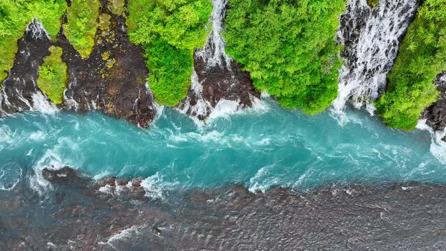 Cold Turquoise Glacial River With Many Streams In Summer Season, Scenic Waterfall in Iceland, Epic aerial landscape