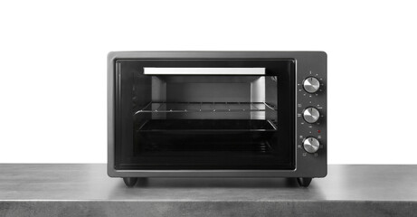 One electric oven on grey table against white background