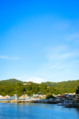 Obraz premium View of the town by the Romblon Bay in the afternoon. Portrait. Romblon Island, Philippines
