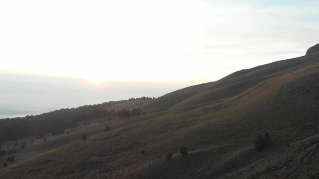 Sunrise on Mountain Drone Shot Towards Sun 1