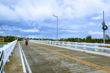 Crossing the bridge in a small town. Magdiwang, Romblon, Philippines