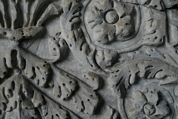 Intricate details of a wall carving reveal delicate patterns and textures