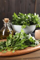 Fresh green parsley on wooden table, space for text