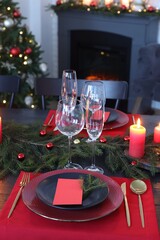 Elegant Christmas table setting with blank place cards and festive decor