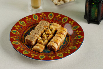 Mini Peanut Baklava on Red Ceramic Plate